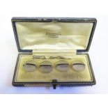 A Tiffany & Co. Cased Set of Four Glass and Hardstone Mounted Studs, one A/F
