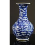 A 19th Century Chinese Blue and White Vase decorated with a dragon, four character Qianlong mark,