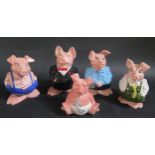 A Set of Four Wade NatWest Piggybanks and One other