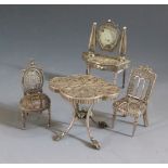 A Silver Filigree Doll's House Dressing Table (67mm high) with two chairs and damaged table