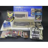 A Commodore 64 Computer Boxed with Manual with C2N Cassette and Games. (items not tested).