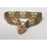 A 9ct Yellow Gold Five Row Gate Link Bracelet with polished wavy and textured joining links and