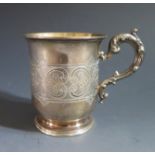 A Victorian Silver Christening Mug with engraved foliate scroll decoration and scrolling foliate