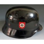 A German Third Reich Lightweight Police Helmet, inside rim stamped DIN14940 and LS in a circle,