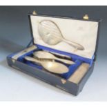 A Cased George V Silver Backed Six Part Hand Mirror, Brush and Comb Set, Birmingham 1928, Mappin &