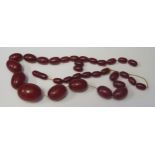 A Selection of Faux Cherry Amber Beads, largest 28x21mm, 48.2g