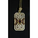 An Art Deco Style 18ct Yellow Gold, Ruby and Diamond Pave Set Pendant / Brooch with a hinged pendant
