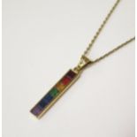 An 18ct Yellow Gold 'Rainbow' Pendant with channel set square cut amethyst, sapphires, demantoid