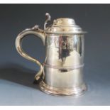 A George II Silver Lidded Tankard with scrolling thumb piece and contemporary initial M*M to the