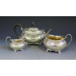 A Pretty Edward VII Silver Bachelor's Three Part Tea Set with chased foliate scroll decoration,