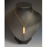A 1977 9ct Gold Ingot Pendant on a 9ct gold 20" chain, 37mm drop, 15g