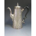 An Important Channel Islands Jersey Silver Coffee Pot with extensive chased foliate scroll and flor