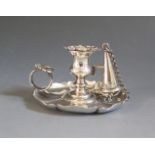 A Victorian Silver Chamberstick with detachable sconce and snuffer and with scalloped thumb piece,