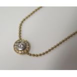 An 18ct Yellow Gold Fifteen Stone Diamond Cluster Pendant with white rub over central setting and on