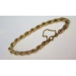 A 9ct Gold Hollow Rope Link Bracelet with safety chain, c. 7.25", 7.6g