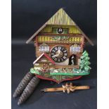An Automaton Musical Cuckoo Clock with pendulum and weights