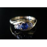 An 18ct Gold, Sapphire and Diamond Three Stone Ring, size M, 3.1g