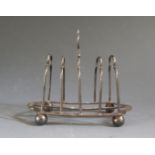 An Edward VII Silver Four Slot Toast rack, Sheffield 1902, Thomas Bradbury & Sons Ltd., 66.1g