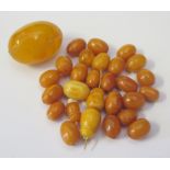 A Selection of Baltic Amber Beads (14.5g) and faux amber bead (10.8g)
