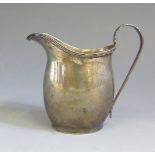 A Small George V Silver Creamer with acanthus leaf handle, 8.5cm high, Chester 1915, marks rubbed,