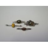 A Selection of Faux Amber Brooches