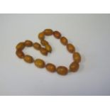A 15.5" Graduated Baltic Amber Strand, largest bead 20mm, 42.1g