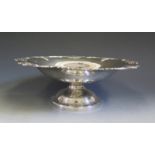 A George VI Silver Circular Stemmed Bowl with foliate scroll rim, 28cm diam., Birmingham 1937,