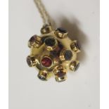 An 18ct Yellow Gold and Multi-Stone Set Ball Pendant (16mm diam.) on an 18ct 16" fine trace