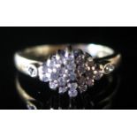 A 9ct Gold and Diamond Cluster Ring, size L.5, 2.9g