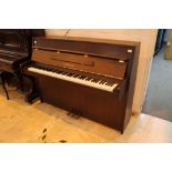 Yamaha (c1998) A Model E110N upright piano in a modern style satin mahogany case.