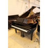 Yamaha (c2000) A 6ft 11in Model C6 grand piano in a bright ebonised case on square tapered legs.