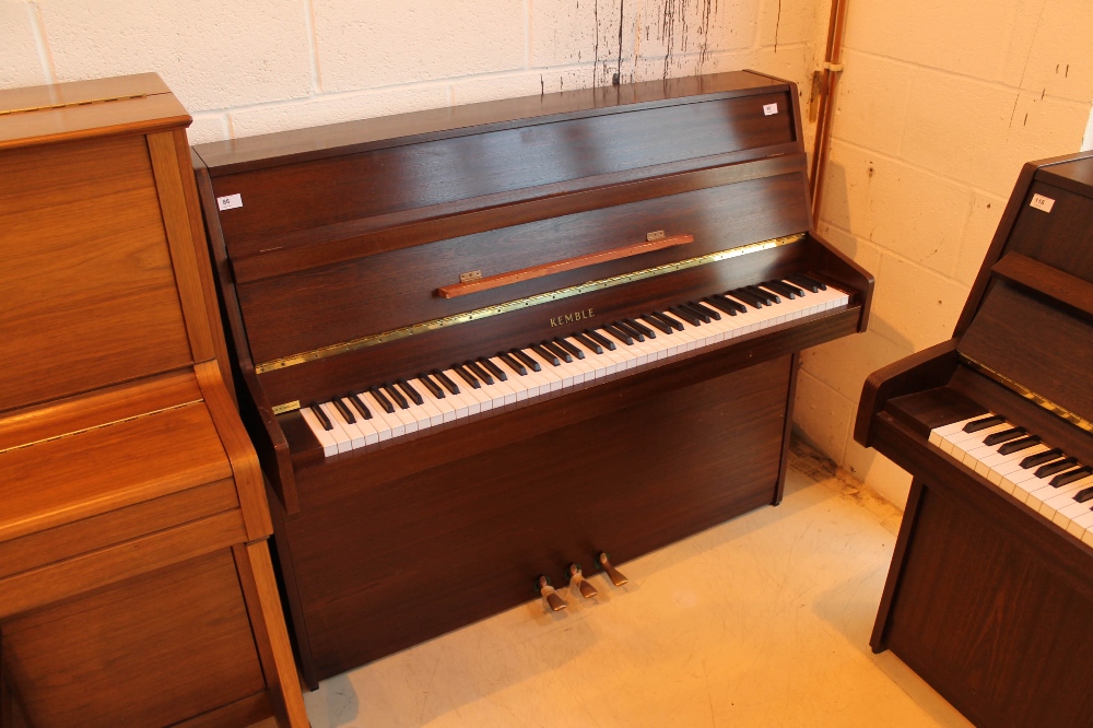 Kemble (c1985) An upright piano in a modern style satin mahogany case.