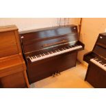 Kemble (c1985) An upright piano in a modern style satin mahogany case.