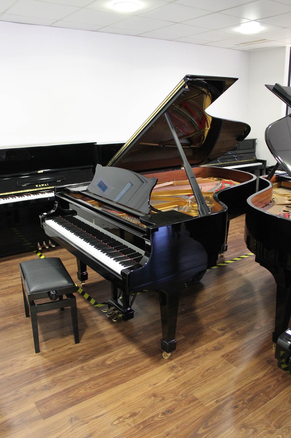 Steinway (c2015) A 6ft 11in Model B grand piano in a bright ebonised case on square tapered legs;