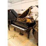Chelsea London A recent small grand piano in a bright ebonised case on turned fluted legs.
