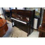 Welmar (c1996) A 126cm upright piano in a traditional bright mahogany case.