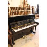 Bentley (c2003) A Model 115M2 upright piano in a traditional bright ebonised case.