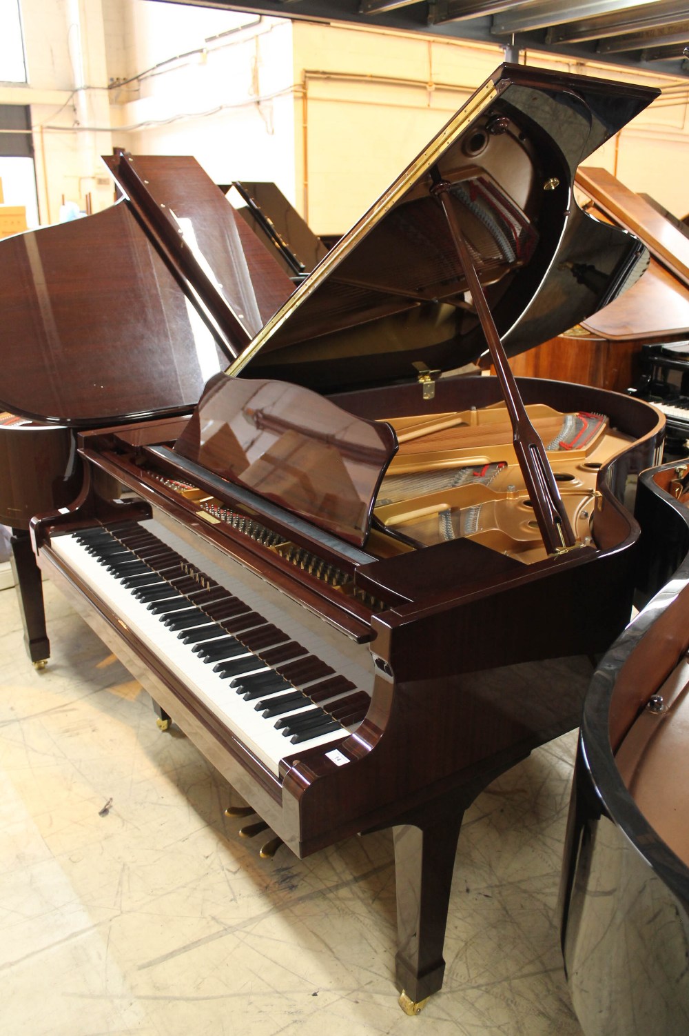 Yamaha (c2002) A 6ft 1in Model C3 grand piano in a bright mahogany case on square tapered legs.