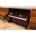 Samick (c1991) A 120cm upright piano in a bright mahogany case;
