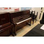 Yamaha (c1991) A Model U1N 120cm upright piano in a bright mahogany case; together with a stool.
