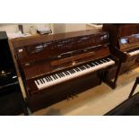 R Schirmer (c1980s) A modern style upright piano in a bright mahogany case;