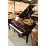 Boston (c2009) A 5ft 10in Model GP178 grand piano in a bright mahogany case on square tapered legs;