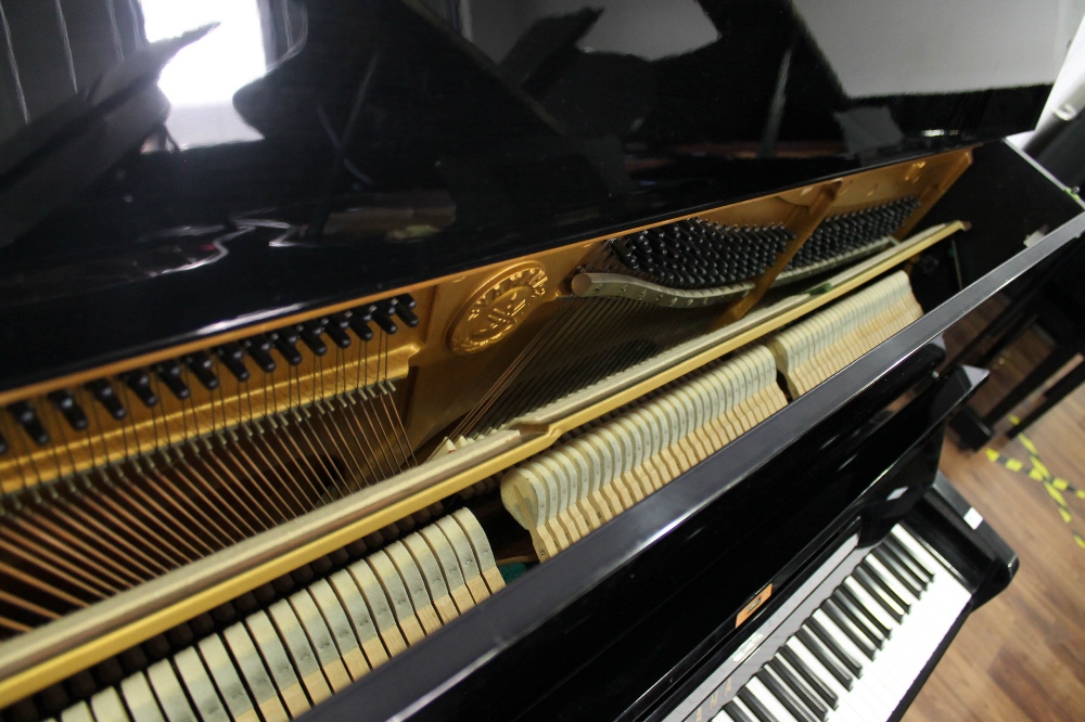 Yamaha (c1976) A Model U1 upright piano in a bright ebonised case. - Image 4 of 4