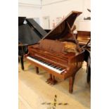 Kawai (c1981) A 5ft 10in Model KG-2C grand piano in a bright walnut case on square tapered legs.