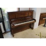 Steinway (c1929) A Model K upright piano in a mahogany case; together with a stool.