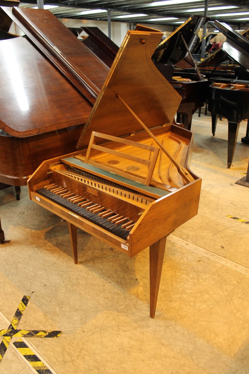 Sperrhake (c1960’s) A 4ft 9in harpsichord in a walnut case on three slender square tapered legs.