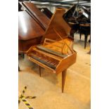 Sperrhake (c1960’s) A 4ft 9in harpsichord in a walnut case on three slender square tapered legs.