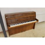 Steinway (c1964) A Model Z upright piano in a modern style walnut case; together with a stool.