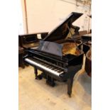 Steinway (c1971) A 6ft 11in Model B grand piano in a bright ebonised case on square tapered legs;