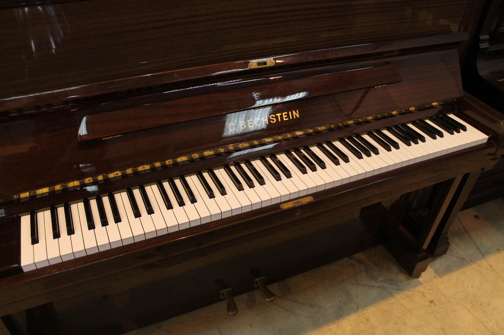 Bechstein (c1988) A Model 12 upright piano in a bright mahogany case; - Image 2 of 5